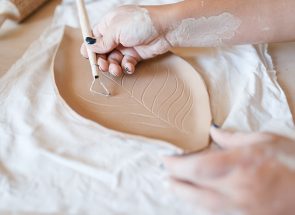 female-potter-draws-a-pattern-pottery-workshop-XWPCZ9D.jpg female-potter-draws-a-pattern-pottery-workshop-XWPCZ9D.jpg